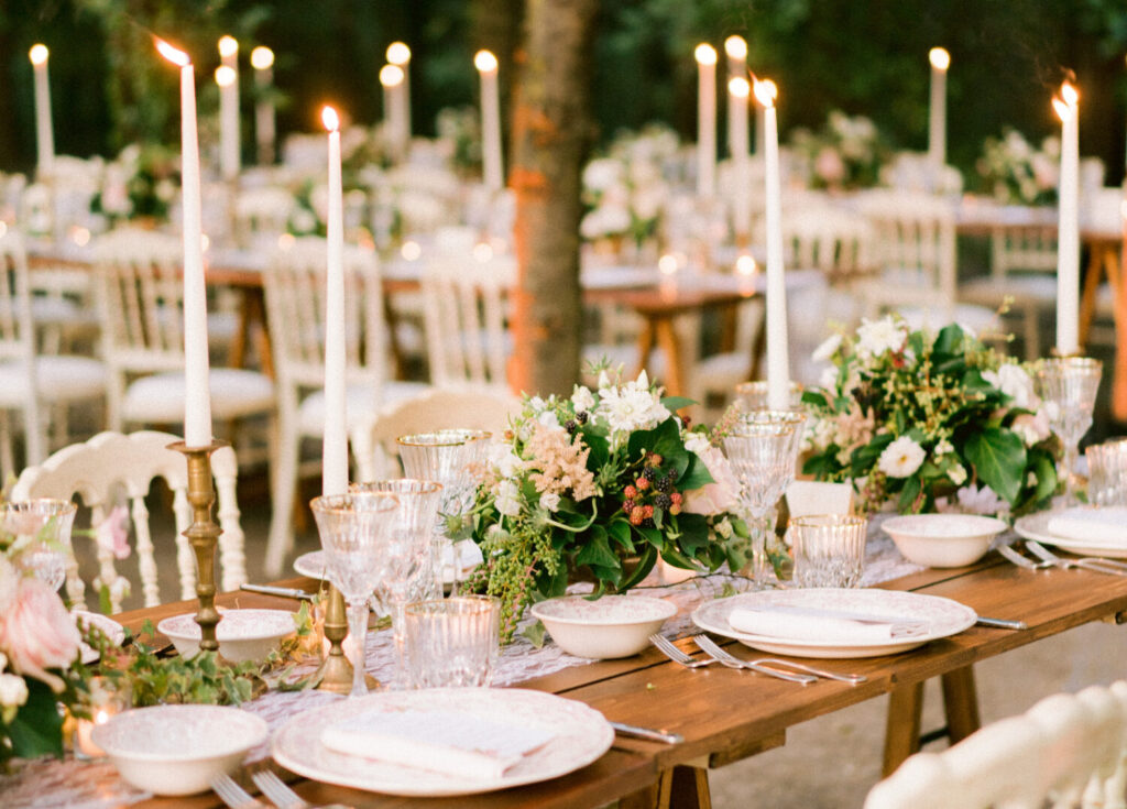 destination wedding in Greece - outdoor wedding setting for the wedding dinner with romantic centerpieces and candles
