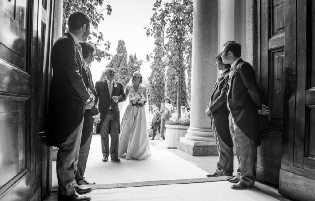 vintage retro bride entering the church for her wedding ceremony