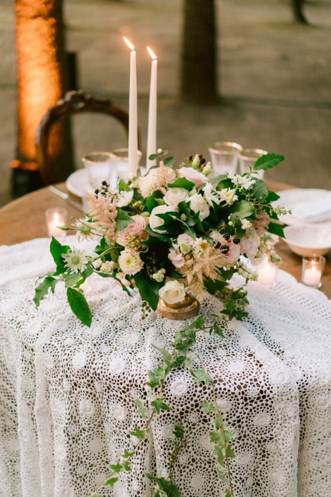 bride and groom wedding table with romantic flowers and candles