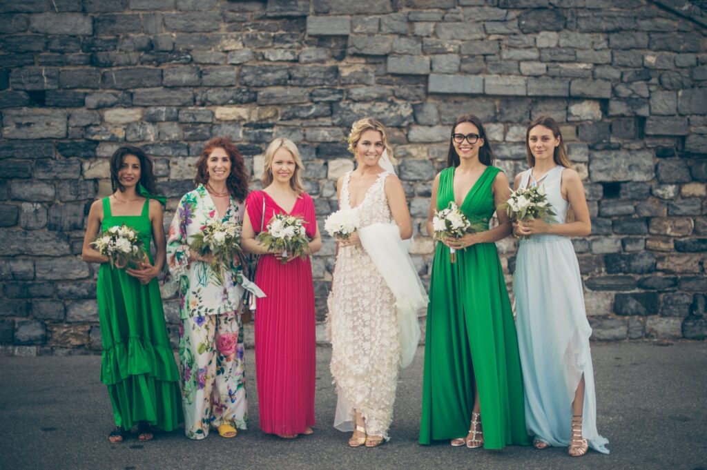 bride and her bridesmaids with dresses from atelier crespi wedding planner italia