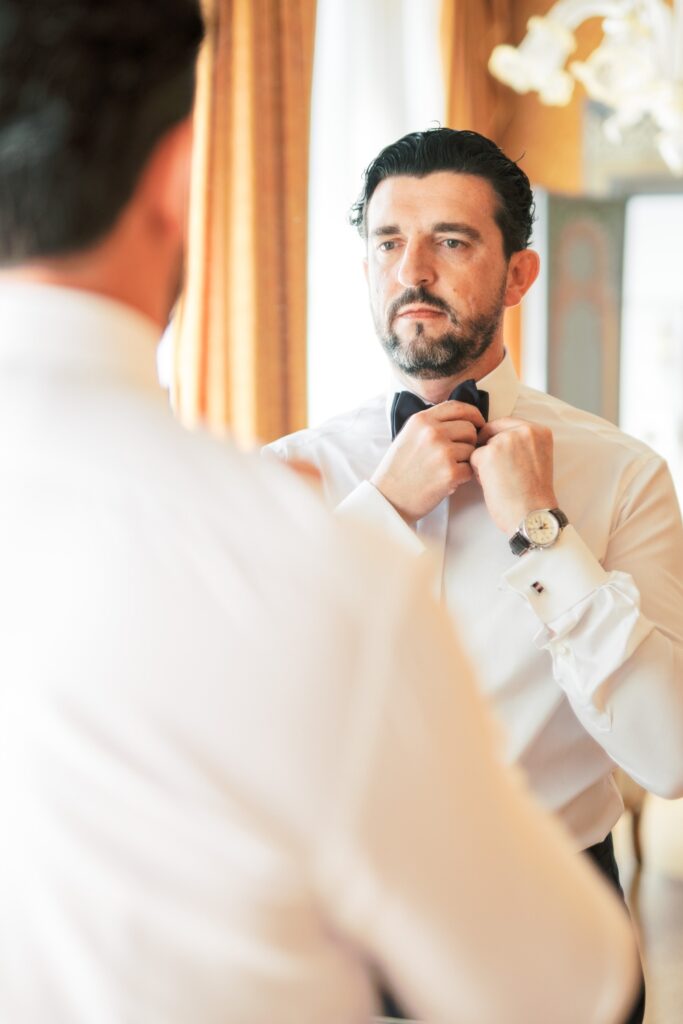 groom getting ready for his destination wedding